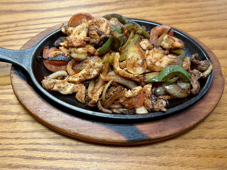 44. Steak, Chicken and Shrimp Fajitas 
